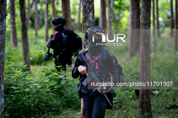 Snipers patrol the jungle in Pattani. Special Forces, the Black Army, and Volunteer Force Operations in Thailand's Deep South perform intell...