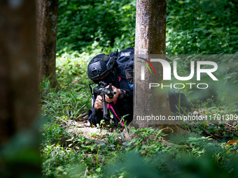 Snipers patrol the jungle in Pattani. Special Forces, the Black Army, and Volunteer Force Operations in Thailand's Deep South perform intell...