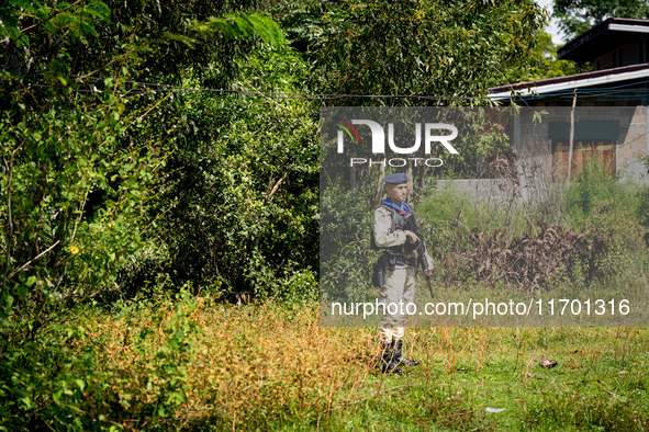 A sniper protects the area from a spot in the jungle near Pattani. Special Forces, the Black Army, and Volunteer Force Operations in Thailan...