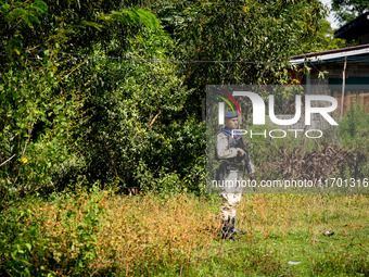 A sniper protects the area from a spot in the jungle near Pattani. Special Forces, the Black Army, and Volunteer Force Operations in Thailan...