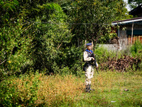 A sniper protects the area from a spot in the jungle near Pattani. Special Forces, the Black Army, and Volunteer Force Operations in Thailan...