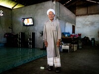 Yuso Sani, Imam of the Numdum Community, Pattani, stands for a portrait in his village. Special Forces, the Black Army, and Volunteer Force...