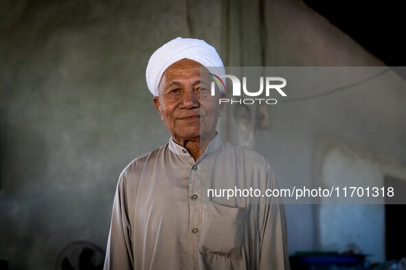 Yuso Sani, Imam of the Numdum Community, Pattani, stands for a portrait in his village. Special Forces, the Black Army, and Volunteer Force...