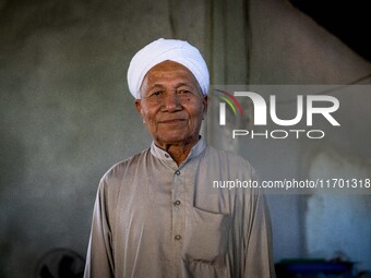 Yuso Sani, Imam of the Numdum Community, Pattani, stands for a portrait in his village. Special Forces, the Black Army, and Volunteer Force...