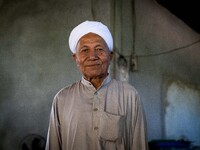 Yuso Sani, Imam of the Numdum Community, Pattani, stands for a portrait in his village. Special Forces, the Black Army, and Volunteer Force...