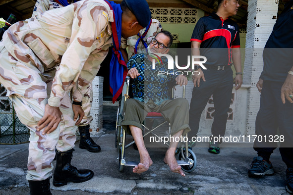 Members of the army and volunteer task force provide healthcare and other necessary supplies to families in need in villages around Pattani....