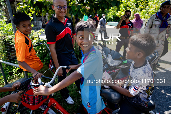 Kids on a motorbike greet the media visiting their village for the first time. Special Forces, the Black Army, and Volunteer Force Operation...