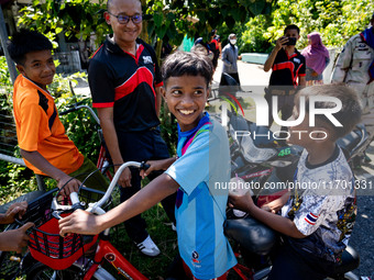 Kids on a motorbike greet the media visiting their village for the first time. Special Forces, the Black Army, and Volunteer Force Operation...