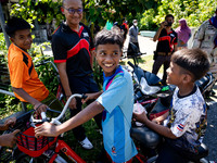 Kids on a motorbike greet the media visiting their village for the first time. Special Forces, the Black Army, and Volunteer Force Operation...