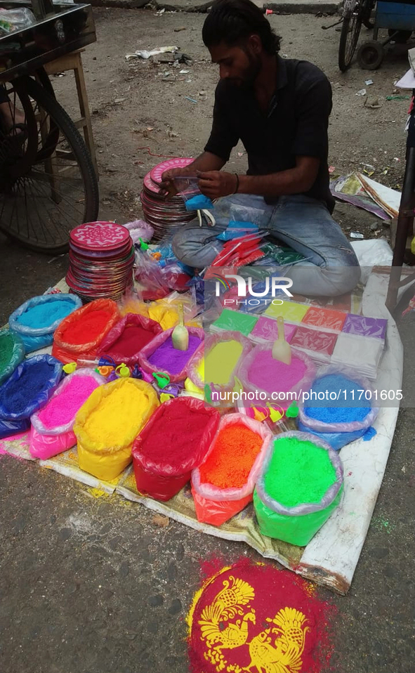 Sellers from Uttar Pradesh State sell Rangoli colors for Diwali home decoration in Siliguri, India, on October 24, 2024. 