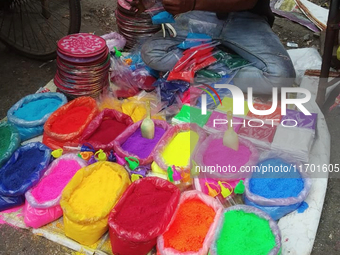 Sellers from Uttar Pradesh State sell Rangoli colors for Diwali home decoration in Siliguri, India, on October 24, 2024. (