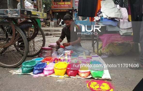 Sellers from Uttar Pradesh State sell Rangoli colors for Diwali home decoration in Siliguri, India, on October 24, 2024. 