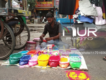 Sellers from Uttar Pradesh State sell Rangoli colors for Diwali home decoration in Siliguri, India, on October 24, 2024. (