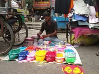 Sellers from Uttar Pradesh State sell Rangoli colors for Diwali home decoration in Siliguri, India, on October 24, 2024. (