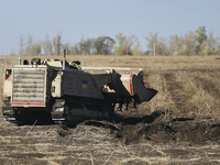 A specialized vehicle is seen during the humanitarian demining using the latest remote control equipment in the Kharkiv region, Ukraine, on...