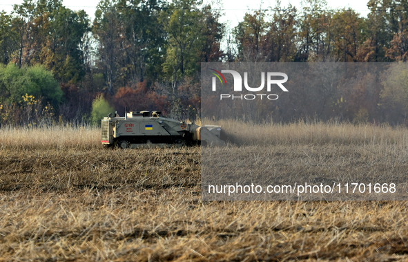 A specialized vehicle is seen during the humanitarian demining using the latest remote control equipment in the Kharkiv region, Ukraine, on...