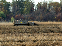 A specialized vehicle is seen during the humanitarian demining using the latest remote control equipment in the Kharkiv region, Ukraine, on...