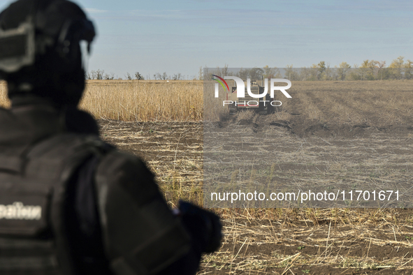 A rescuer works on humanitarian demining using the latest remote control equipment in the Kharkiv region, Ukraine, on October 23, 2024. 