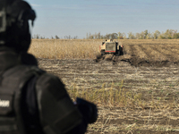 A rescuer works on humanitarian demining using the latest remote control equipment in the Kharkiv region, Ukraine, on October 23, 2024. (