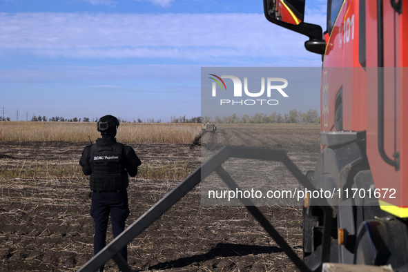 A rescuer works on humanitarian demining using the latest remote control equipment in the Kharkiv region, Ukraine, on October 23, 2024. 