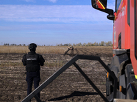 A rescuer works on humanitarian demining using the latest remote control equipment in the Kharkiv region, Ukraine, on October 23, 2024. (