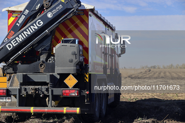 A specialized vehicle is seen during the humanitarian demining using the latest remote control equipment in the Kharkiv region, Ukraine, on...