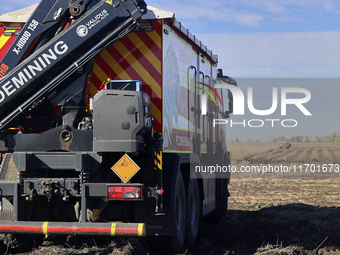 A specialized vehicle is seen during the humanitarian demining using the latest remote control equipment in the Kharkiv region, Ukraine, on...