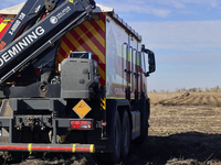 A specialized vehicle is seen during the humanitarian demining using the latest remote control equipment in the Kharkiv region, Ukraine, on...