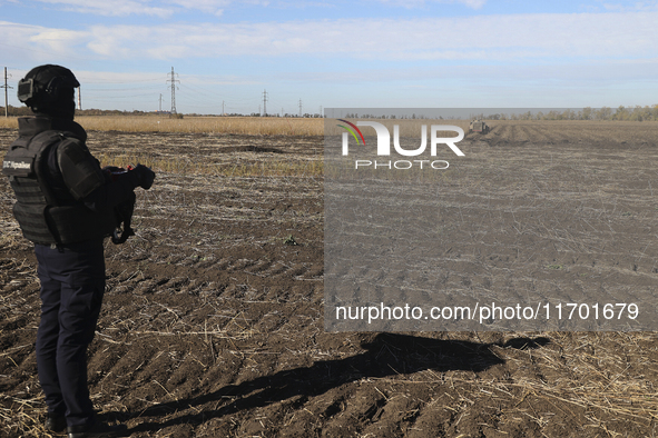 A rescuer works on humanitarian demining using the latest remote control equipment in the Kharkiv region, Ukraine, on October 23, 2024. 