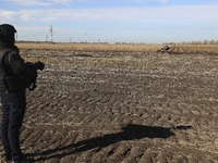 A rescuer works on humanitarian demining using the latest remote control equipment in the Kharkiv region, Ukraine, on October 23, 2024. (