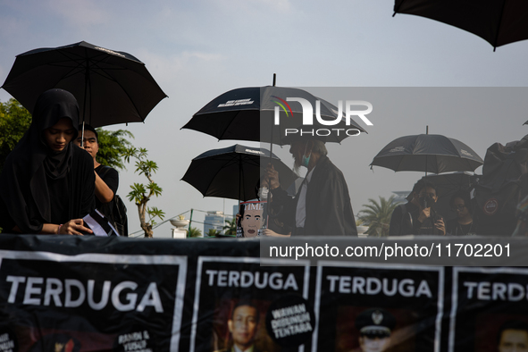 Human rights activists participate in the 837th Aksi Kamisan, or Thursday's Protest, in front of the Merdeka Palace in Jakarta, Indonesia, o...