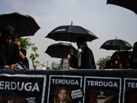 Human rights activists participate in the 837th Aksi Kamisan, or Thursday's Protest, in front of the Merdeka Palace in Jakarta, Indonesia, o...