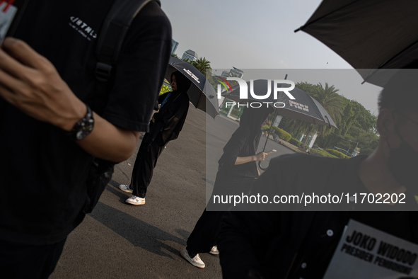 Human rights activists participate in the 837th Aksi Kamisan, or Thursday's Protest, in front of the Merdeka Palace in Jakarta, Indonesia, o...