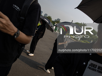 Human rights activists participate in the 837th Aksi Kamisan, or Thursday's Protest, in front of the Merdeka Palace in Jakarta, Indonesia, o...