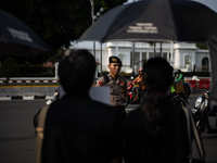 Police guard the 837th Aksi Kamisan, or Thursday's Protest, in front of the Merdeka Palace in Jakarta, Indonesia, on October 24, 2024. This...