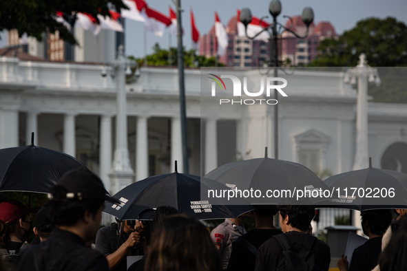 People participate in the 837th Aksi Kamisan, or Thursday's Protest, in front of the Merdeka Palace in Jakarta, Indonesia, on October 24, 20...