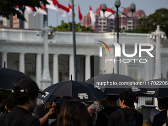 People participate in the 837th Aksi Kamisan, or Thursday's Protest, in front of the Merdeka Palace in Jakarta, Indonesia, on October 24, 20...