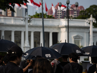 People participate in the 837th Aksi Kamisan, or Thursday's Protest, in front of the Merdeka Palace in Jakarta, Indonesia, on October 24, 20...