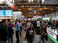 Participants browse on a book stand during the 27. International Book Fair in The International Exhibition and Convention Centre EXPO in Kra...