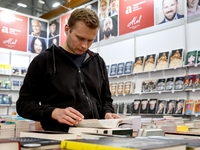 A participant browse on a book stand during the 27. International Book Fair in The International Exhibition and Convention Centre EXPO in Kr...