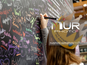 Young adult leaves her signature during the 27. International Book Fair in The International Exhibition and Convention Centre EXPO in Krakow...