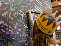 Young adult leaves her signature during the 27. International Book Fair in The International Exhibition and Convention Centre EXPO in Krakow...