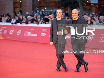 Gianmarco Franchini and Luca Zingaretti attend the ''La Casa Degli Sguardi'' red carpet during the 19th Rome Film Festival at Auditorium Par...