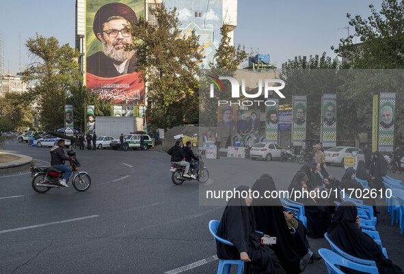 A giant banner features a portrait of Lebanon's Hezbollah Secretary General, Hashem Safieddine, who is killed in an Israeli airstrike, durin...