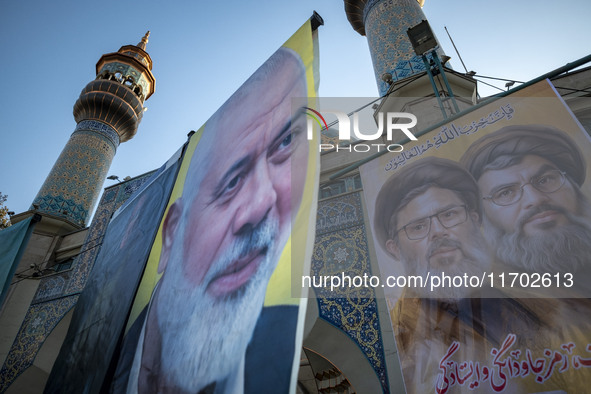 Banners featuring portraits of Lebanon's Hezbollah leaders, Hassan Nasrallah (R) and Hashem Safieddine, who are killed in Israeli airstrikes...