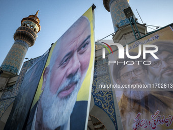 Banners featuring portraits of Lebanon's Hezbollah leaders, Hassan Nasrallah (R) and Hashem Safieddine, who are killed in Israeli airstrikes...