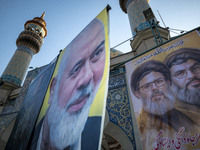 Banners featuring portraits of Lebanon's Hezbollah leaders, Hassan Nasrallah (R) and Hashem Safieddine, who are killed in Israeli airstrikes...