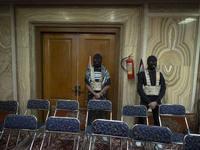 Islamic Revolutionary Guard Corps (IRGC) personnel wear masks and flak jackets, symbolizing Hamas warriors, and stand at attention during a...