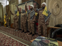 Islamic Revolutionary Guard Corps (IRGC) military personnel wear Palestinian scarves and uniforms, symbolizing Hamas warriors, and shout ant...