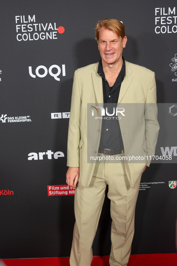 Enno Kalisch, a German actor, poses on the red carpet before the closing award ceremony of the Cologne Film Festival 2024 at E-Werk in Colog...